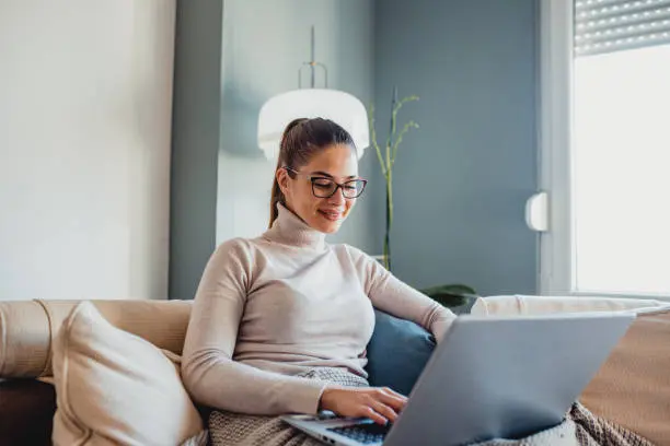 A woman working with a laptop