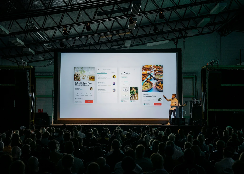man giving sales pitch on stage