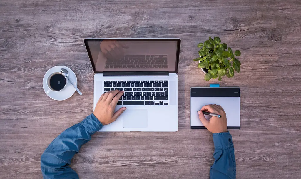 A man using his laptop to do an audit