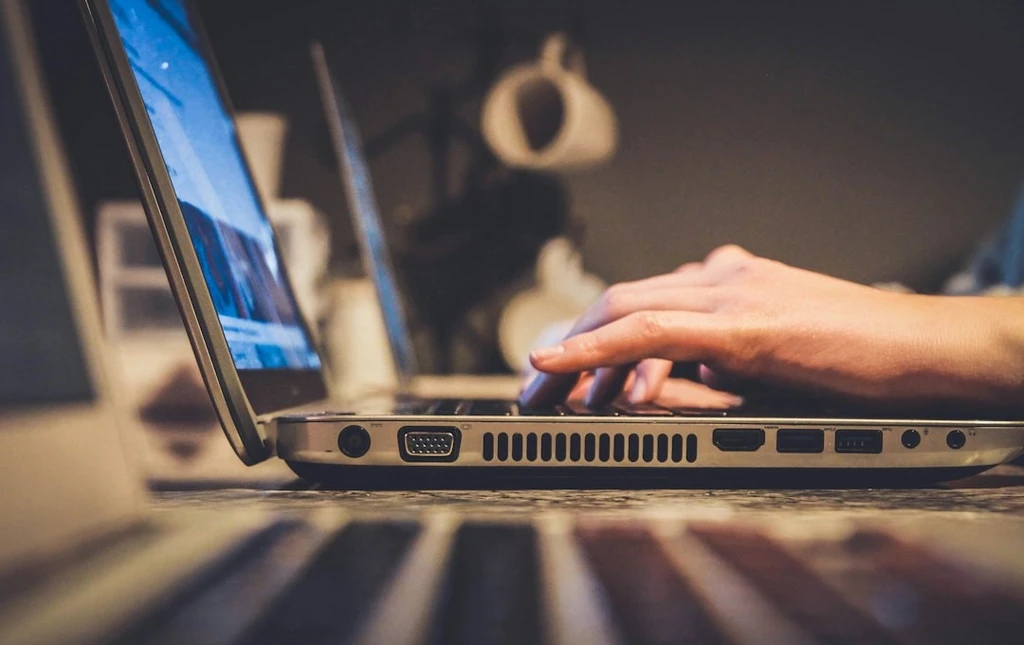 Typing in a laptop